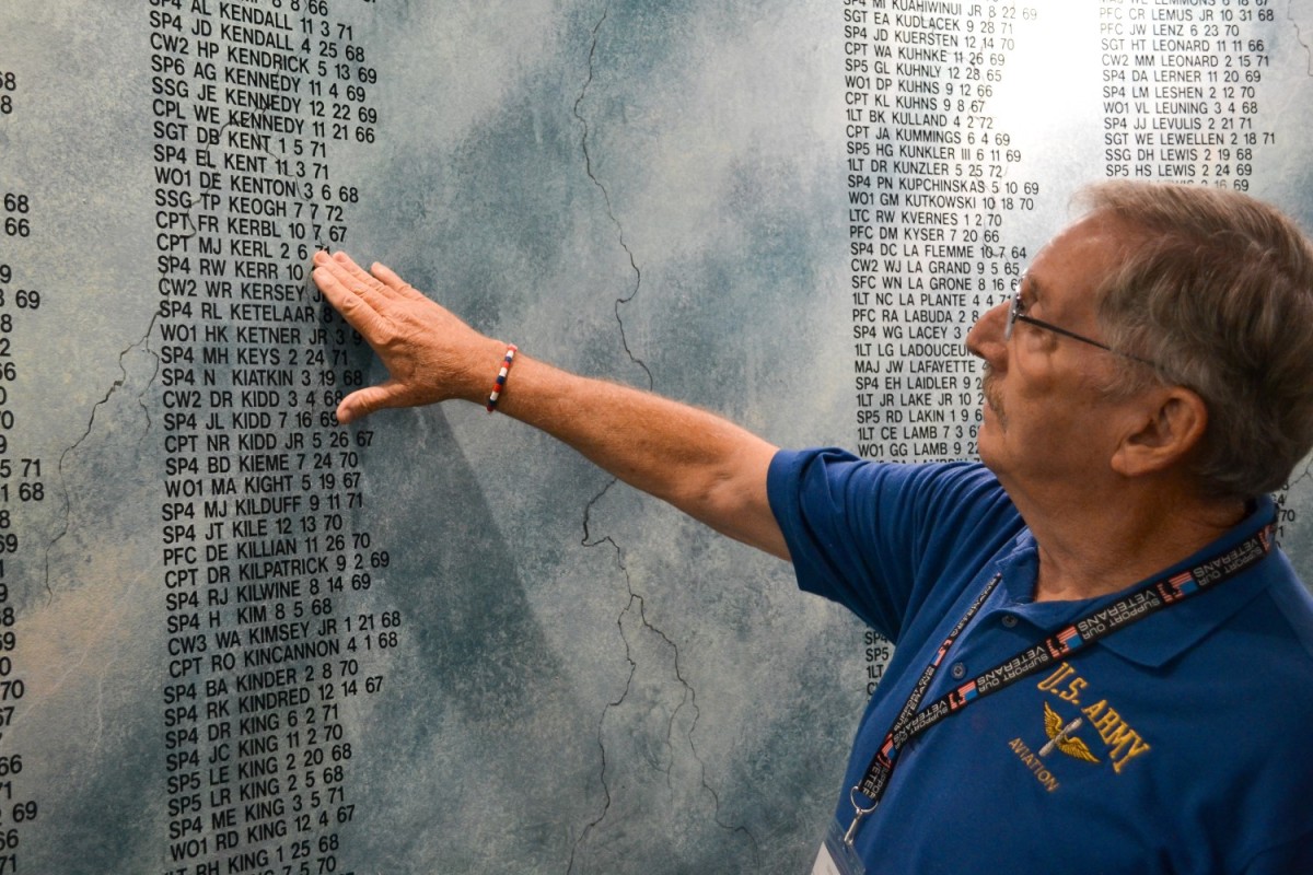 Vietnam Veteran Joseph Vandiver points out a friend’s name on the wall at the Army Aviation Vietnam Memorial inside the Army Aviation Museum on Fort Novosel Sept. 25. (Photo Credit: Chris Mendez) Vietnam Veteran Joseph Vandiver points out a friend’s name on the wall at the Army Aviation Vietnam Memorial inside the Army Aviation Museum on Fort Novosel Sept. 25. (Photo Credit: Chris Mendez)