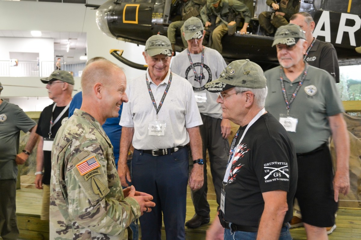 Brig. Gen. Kenneth C. Cole, Deputy Commanding General, US Army Aviation Center of Excellence swaps stories with Harvey Schwab, Reunion Coordinator for the Vietnam Veteran Reunion Tour inside the Army Aviation Museum Sept. 25. (Photo Credit: Chris Mendez) Brig. Gen. Kenneth C. Cole, Deputy Commanding General, US Army Aviation Center of Excellence swaps stories with Harvey Schwab, Reunion Coordinator for the Vietnam Veteran Reunion Tour inside the Army Aviation Museum Sept. 25. (Photo Credit: Chris Mendez)